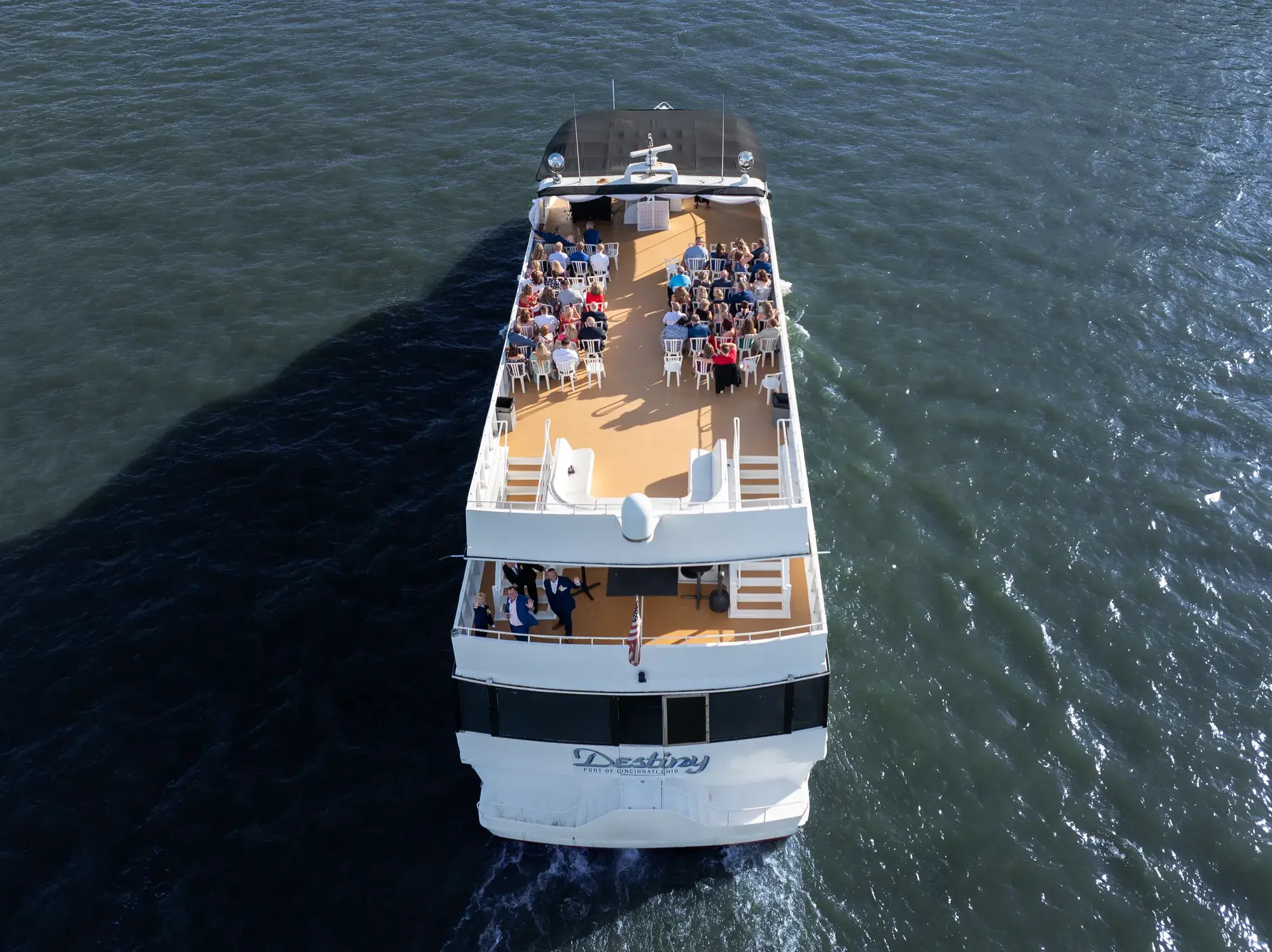 Aerial view of wedding guests on the top deck of The Destiny yacht