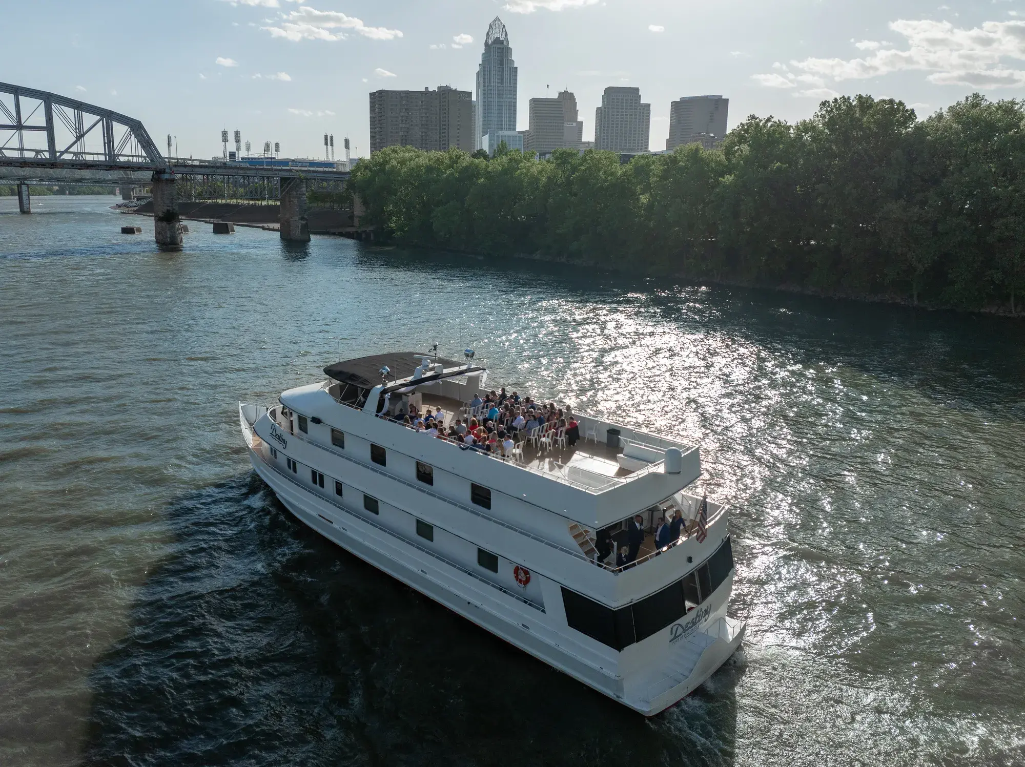 Wedding guests cruising past the Cincinnati skyline aboard The Destiny