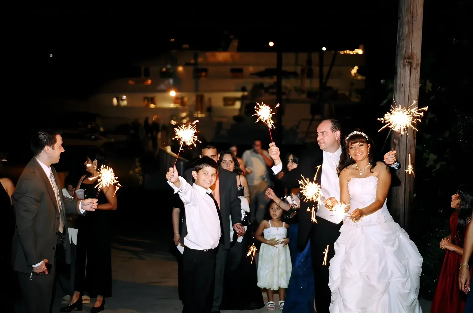Sparkler send-off for the bride and groom at The Destiny dock at night