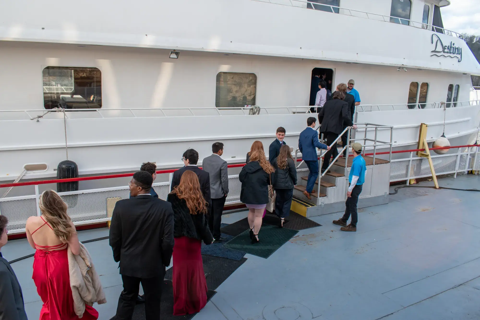 Guests in formal attire boarding The Destiny