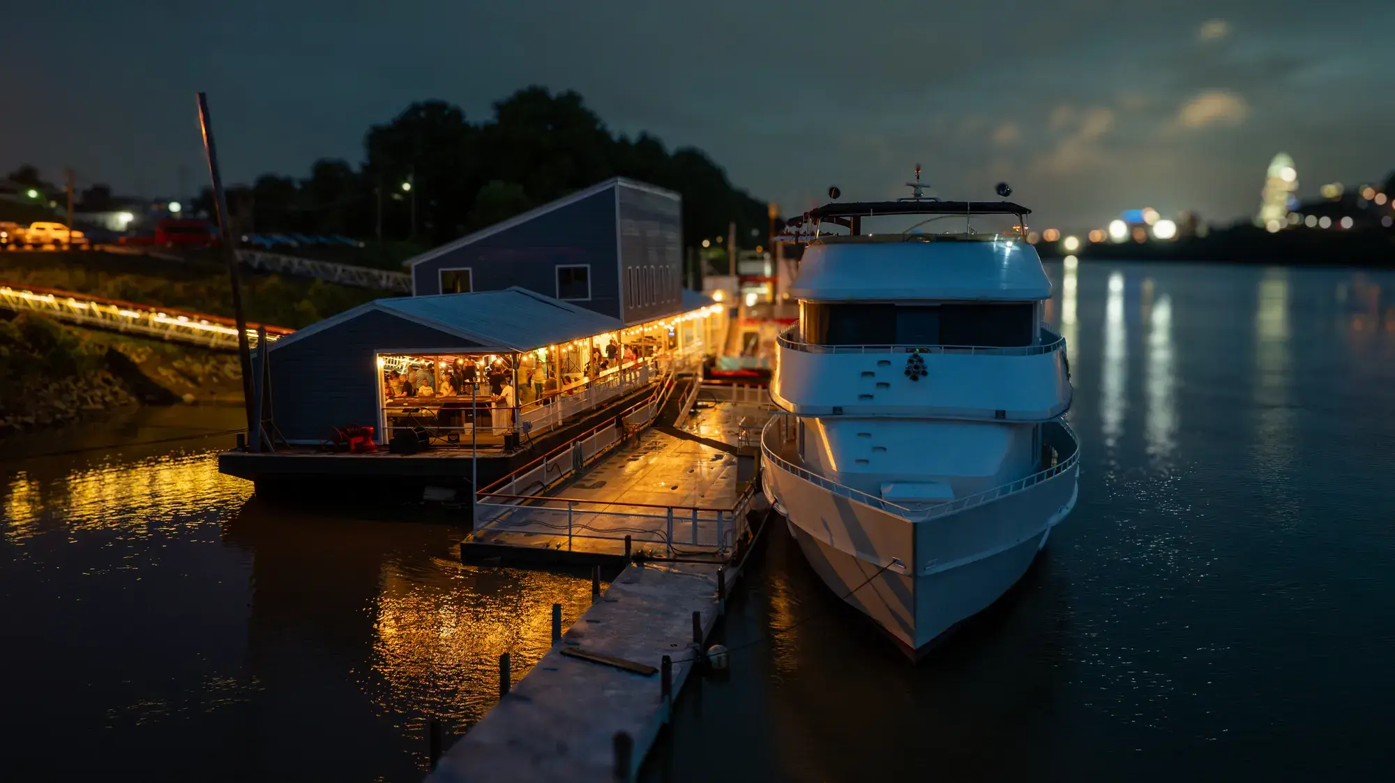 The Destiny yacht at the dock at night