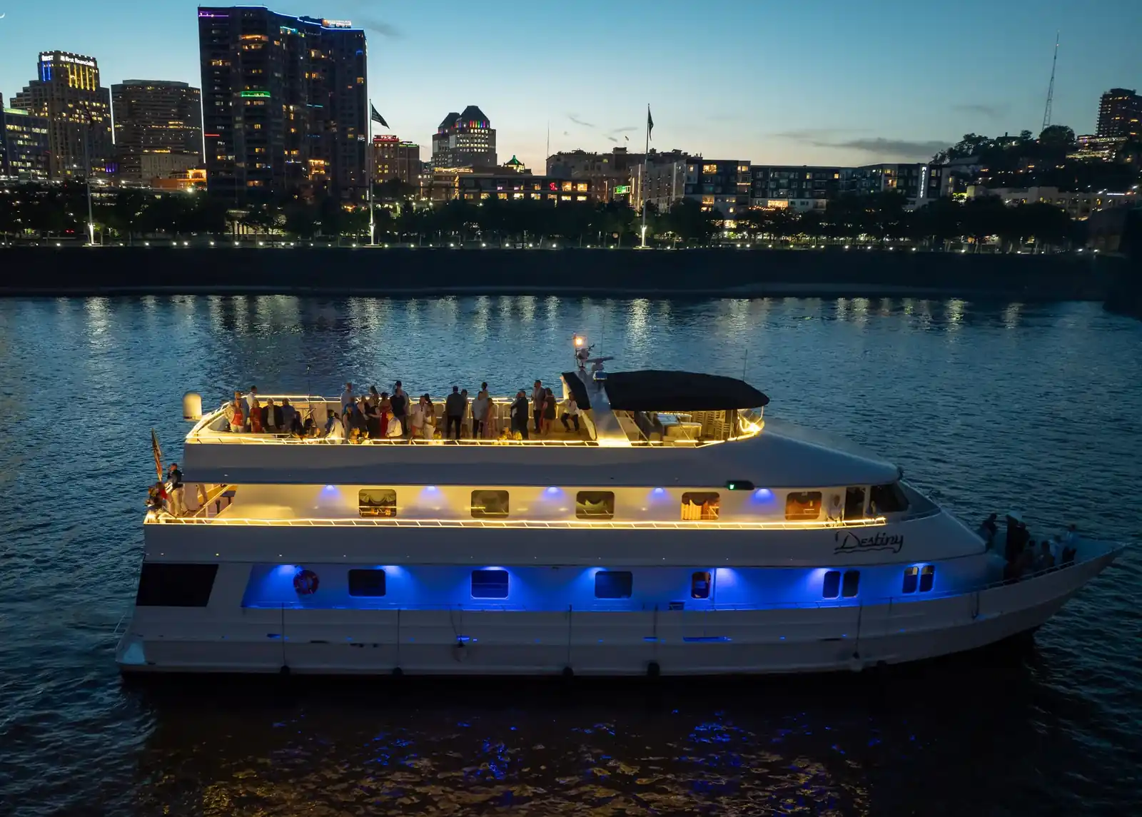 The Destiny with the Cincinnati skyline lit up at night